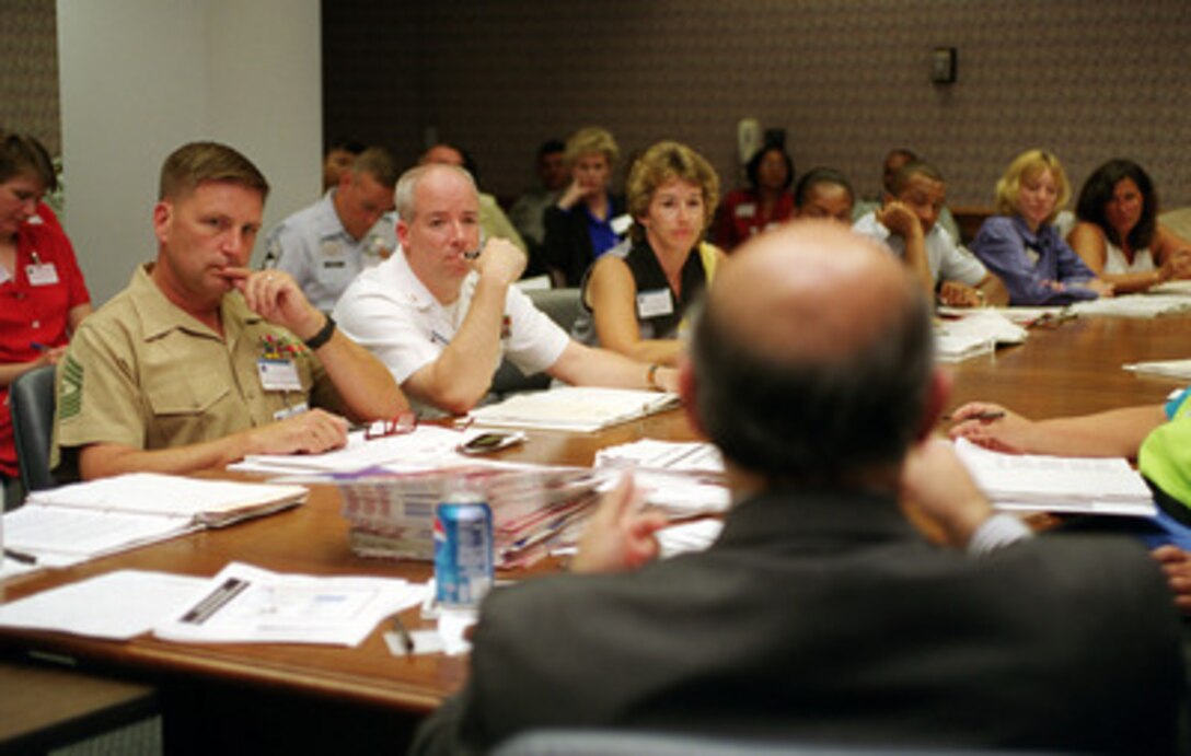 Members of a discussion group focus their attention on schools and education at the 1st Senior Enlisted Advisors Forum in the Pentagon on June 22, 2000. Over 100 participants have been brought to Washington, D.C., to discuss some of the most challenging quality of life issues affecting the military such as child care, health care, recruiting and retention, Department of Defense schools and military compensation. 
