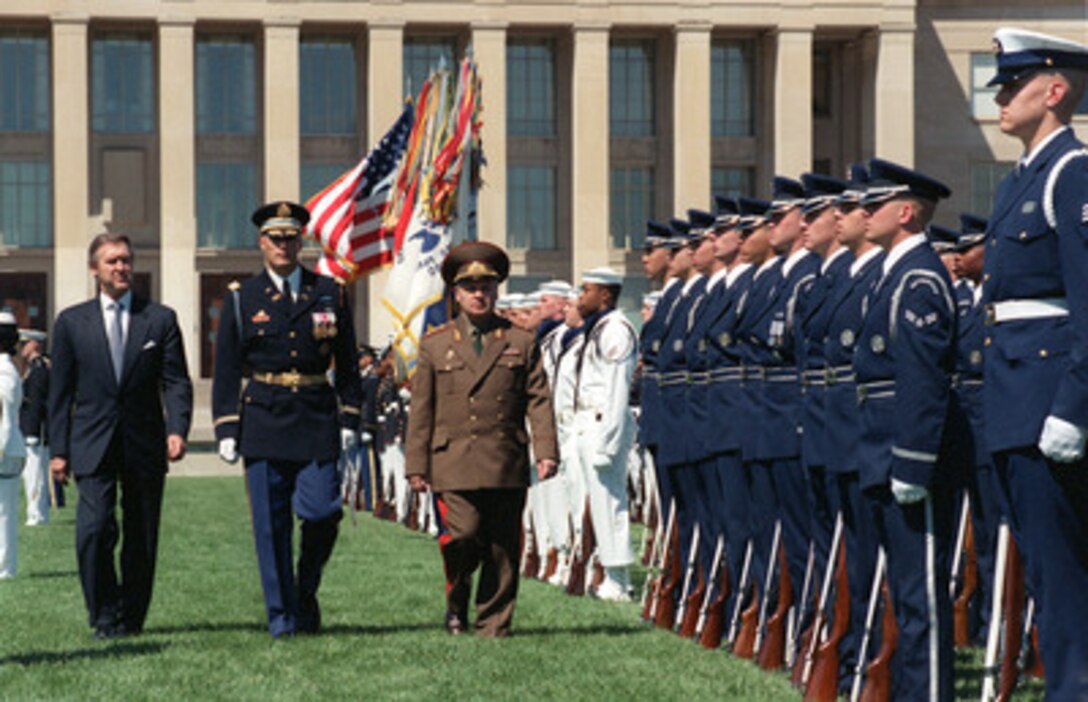 Minister of Defense Gen.-Col. Safar Abiyev (right), of the Azerbaijani Republic, inspects the honor guard during a military full honor arrival ceremony at the Pentagon hosted by Secretary of Defense William S. Cohen (left) on June 30, 2000. Escorting the two defense leaders is the Commander of Troops Col. Thomas M. Jordan, U.S. Army, 3rd United States Infantry (The Old Guard). Following the ceremony Cohen and his senior policy advisors will meet with Abiyev to discuss a range of regional security issues. 