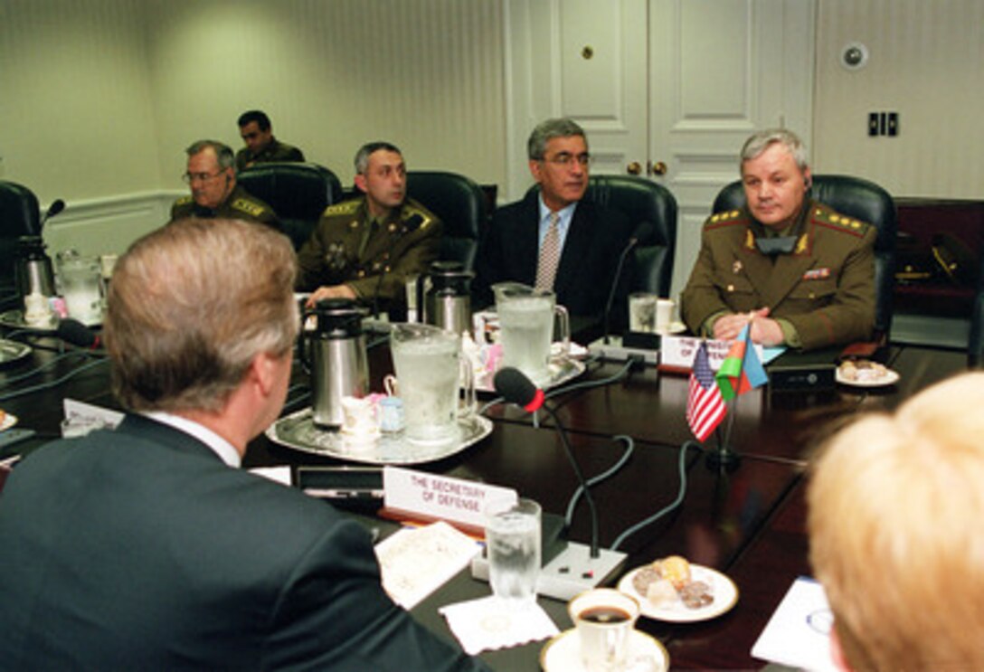 Secretary of Defense William S. Cohen (left foreground) opens a plenary meeting with Minister of Defense Gen.-Col. Safar Abiyev (right), of the Azerbaijani Republic, in the Pentagon on June 30, 2000. Cohen and his senior policy advisors are meeting with Abiyev to discuss a range of regional security issues. Seated left of Gen.-Col. Abiyev is the Azerbaijani Ambassador to the United States Hafiz Pashayev. 