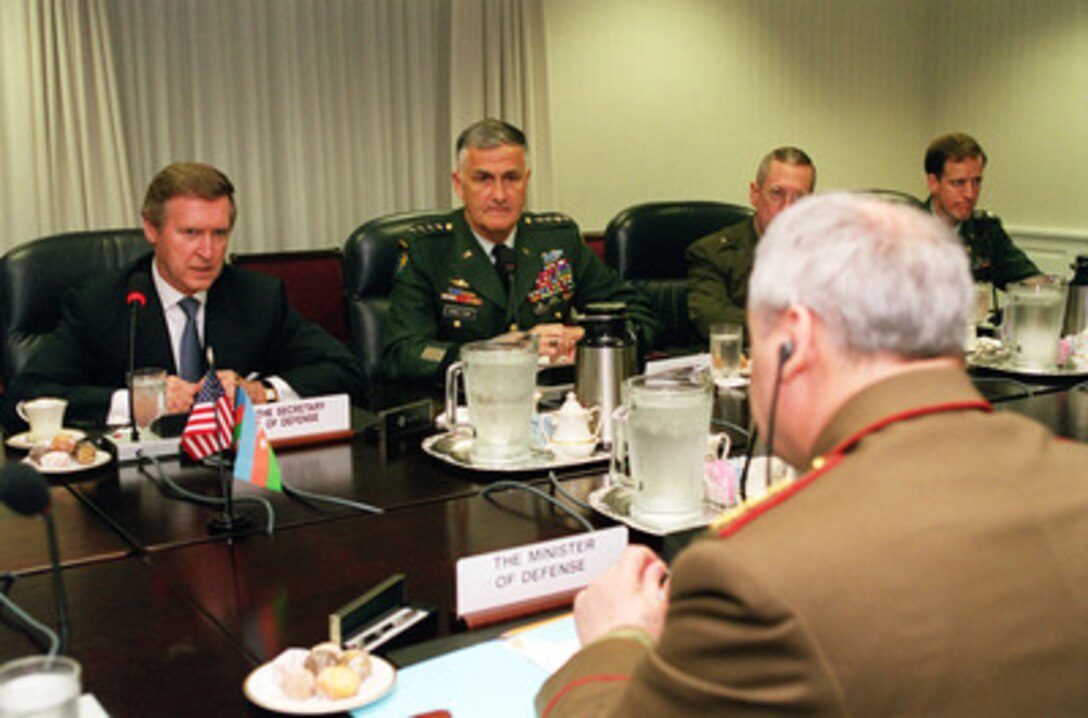 Secretary of Defense William S. Cohen (left) opens a plenary meeting with Minister of Defense Gen.-Col. Safar Abiyev (right), of the Azerbaijani Republic, in the Pentagon on June 30, 2000. Cohen and his senior policy advisors are meeting with Abiyev to discuss a range of regional security issues. Seated beside Cohen is Chairman of the Joint Chiefs of Staff Gen. Henry H. Shelton, U.S. Army. 