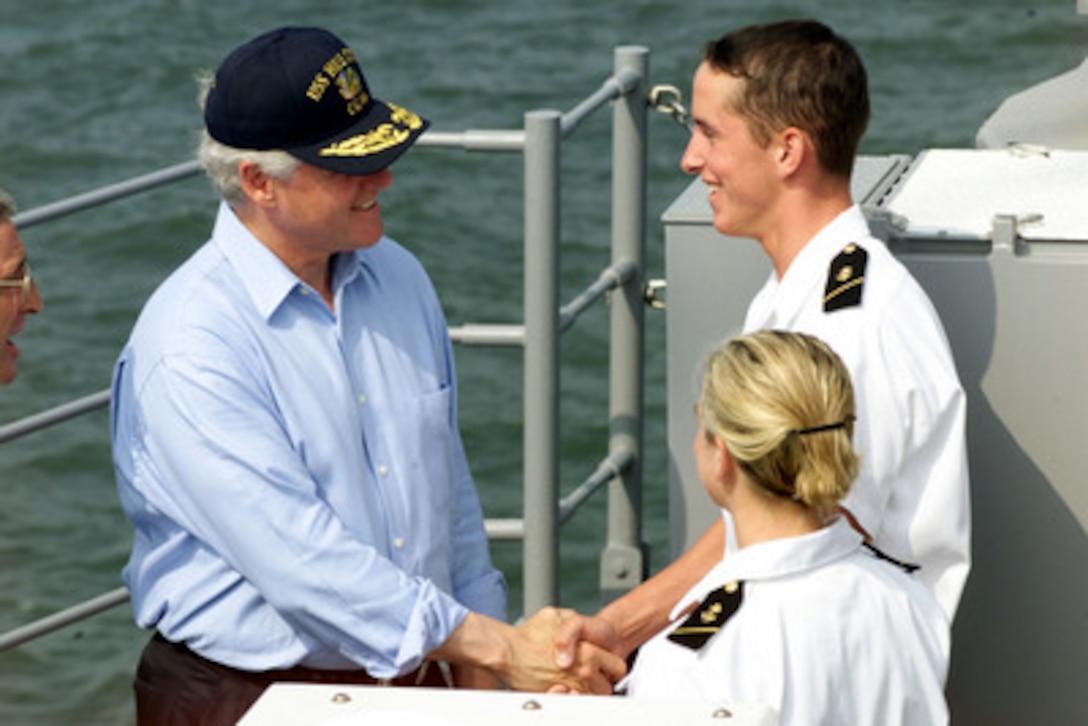 President Bill Clinton greets Midshipman 3rd Class Justin Ott and Midshipman 3rd Class Melissa Reinchenback aboard the USS Hue City (CG 66) on July 4, 2000, in New York Harbor. The president is aboard the Ticonderoga class cruiser to review naval units from around the world for the International Naval Review 2000. Ott is from Delram, N.J. and Reinchenback is from Galloway Township, N.J. 