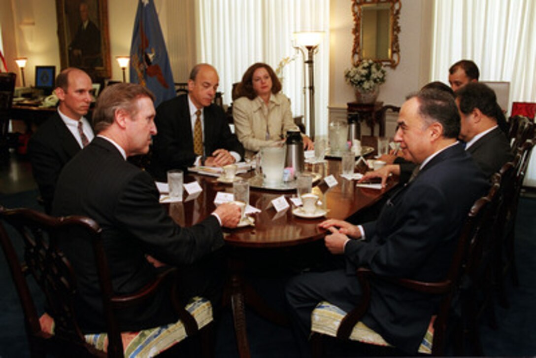 Secretary of Defense William S. Cohen (near left) hosts a meeting in his Pentagon office with Tunisian Minister of Foreign Affairs Habib Ben Yahia (right) on July 7, 2000. The two principals, in concert with their senior policy advisors, are meeting to discuss a range of regional developments and security issues of interest to both nations. 