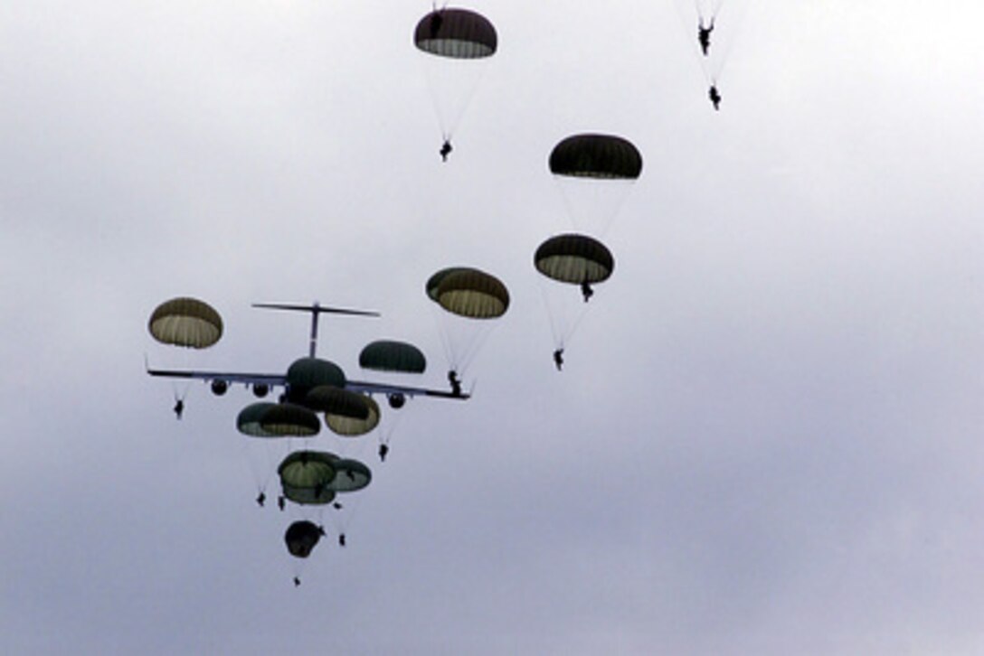 Paratroopers from the U.S. Army's 82nd Airborne Division and the Ukraine's 80th Air Mobile parachute from a U.S. Air Force C-17 Globemaster III during Exercise Peaceshield 2000 at Yavoriv, Ukraine, on July 17, 2000. Approximately 1000 soldiers from 22 countries are taking part in the peacekeeping training exercise at the Partnership for Peace Training Center at Yavoriv. 