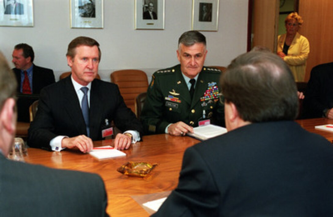 Secretary of Defense William S. Cohen (left) and Chairman of the Joint Chiefs of Staff Gen. Henry H. Shelton (right), U.S. Army, meet with NATO Secretary General Lord George Robertson (right foreground) at NATO Headquarters in Brussels, Belgium, on June 8, 2000. The bilateral talks are preceding two days of general meetings where all 19 NATO defense ministers will meet. 