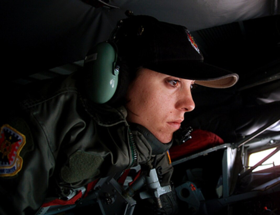 U.S. Air Force Staff Sgt. Alicia Judd, a KC-135 Stratotanker boom operator, prepares to refuel a KC-10 Extender on May 8, 2000, during the aerial refueling competition of Air Mobility Rodeo 2000. Rodeo 2000 is the U.S. Air Force Air Mobility Command's premier air mobility competition, involving more than 80 aircraft and 100 teams from 17 countries. The teams compete in airdrops, aerial refueling, aircraft navigation, special tactics, short field landings, cargo loading, engine running on and off load, aeromedical evacuations and security forces operations. Judd is attached to the Combat Aerial Delivery School, Fairchild Air Force Base, Wash. 