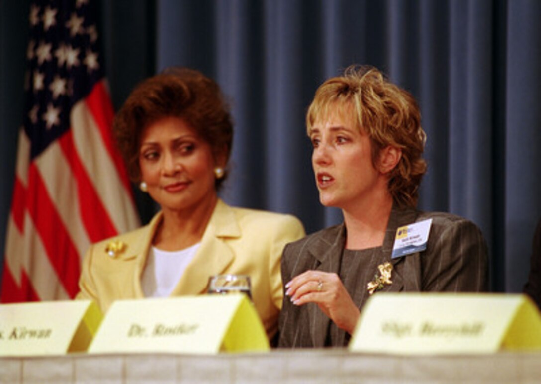 Kelli Kirwan (right) and Janet Langhart Cohen tell reporters at a Pentagon press conference about some of the most important topics dealt with during the Military Family Forum held in the Pentagon on May 31, 2000. One hundred military family members, selected from individual command areas or bases, were brought to the Pentagon to participate in the discussions devoted to military family issues. Kirwan is the wife of a Marine Gunnery Sergeant stationed at Camp Pendleton, Calif., and Cohen is the wife of Secretary of Defense William S. Cohen. 