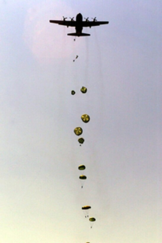 Soldiers from the U.S. Army's 82nd Airborne Division parachute from a C-130 Hercules on May 8, 2000, as part of the airdrop competition of Air Mobility Rodeo 2000. Rodeo 2000 is the U.S. Air Force Air Mobility Command's premier air mobility competition, involving more than 80 aircraft and 100 teams from 17 countries. The teams compete in airdrops, aerial refueling, aircraft navigation, special tactics, short field landings, cargo loading, engine running on and off load, aeromedical evacuations and security forces operations. The aircraft's flight crew is scored on time on target and personnel landing inside a target zone. 