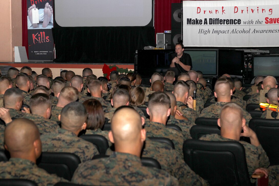 Christopher Rich, a public speaker with the Save a Life Tour speaks to Marines about the dangers of drunk driving during the Save a Life Tour rally at Sunset Cinema Nov. 30, 2010. ::r::::n::
