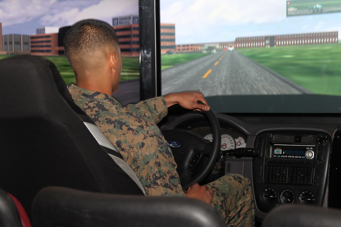 A Marine drives the drunk driving simulator during the Save a Life Tour rally at Sunset Cinema Nov. 30, 2010. The simulator is designed to let Marines experience what driving is like as a drunk driver. ::r::::n::