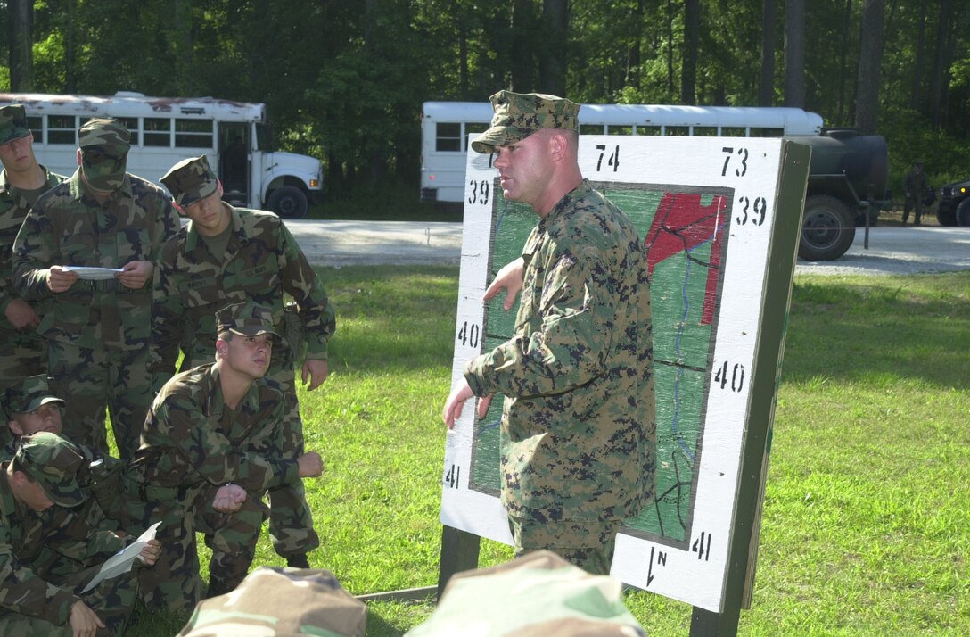 MARINE CORPS BASE CAMP LEJEUNE, N.C. - Sgt. Paul T. DuBois gives a safety brief to a group of midshipmen from various colleges on land navigation here June 15. DuBois is a combat instructor with the School of Infantry, MCB. College students with various Navy Reserve Officer Training Corps from all over the country have visited here to get a glimpse into what it's like as a Marine through the month of June. (Official U.S. Marine Corps photo by Lance Cpl. Brandon R. Holgersen)