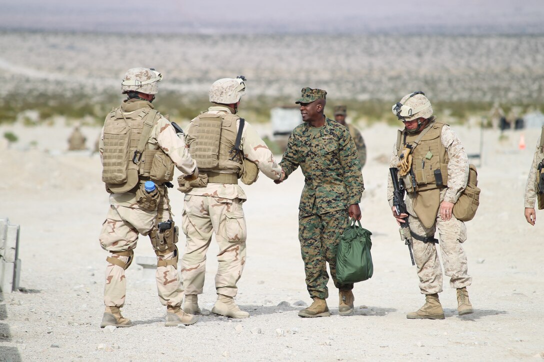 Sergeant Major of the Marine Corps Sgt. Maj. Carlton Kent  speaks with Marines from 3rd Battalion, 2nd Marine Regiment, out of Camp Lejeune, N.C., training on Range 210 for Enhanced Mojave Viper Dec. 6, 2010.