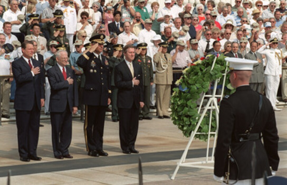 Vice President Al Gore (left), decorated Korean War hero Vince Krepps, Maj. Gen. Robert Ivany and Secretary of Defense William S. Cohen (right) pay their respects before laying a wreath at the Tomb of the Unknowns in Arlington National Cemetery on June 25, 2000, to commemorate the 50th anniversary of the start of the Korean War. 