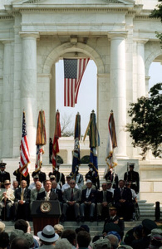 Surrounded by Korean War veterans and their families, Secretary of Defense William S. Cohen reminds Americans that "Freedom is not free." as he speaks at Arlington National Cemetery on June 25, 2000, during ceremonies commemorating the 50th Anniversary of the start of the Korean War. Cohen stressed the importance of remembering the lessons of that war and the sacrifices of the brave men and women of the United States and the 20 allied nations who participated in what is often called "the forgotten war". 