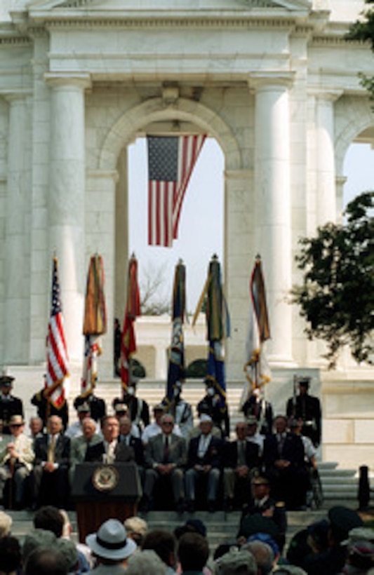 Surrounded by Korean War veterans and their families, Secretary of Defense William S. Cohen reminds Americans that "Freedom is not free." as he speaks at Arlington National Cemetery on June 25, 2000, during ceremonies commemorating the 50th Anniversary of the start of the Korean War. Cohen stressed the importance of remembering the lessons of that war and the sacrifices of the brave men and women of the United States and the 20 allied nations who participated in what is often called "the forgotten war". 