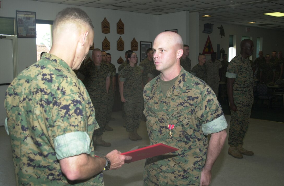 CAMP GEIGER, N.C. - 1st Lt. Samuel C. Cunningham, Company H commander, School of Infantry [East], received a Bronze Star with combat distinguishing device June 22 for heroic achievement while in combat operations.  Cunningham served as an 81 mm Mortar Platoon commander and Combined Action Platoon commander with Weapons Company, 2d Battalion, 1st Marine Division in support of Operation Iraqi Freedom, he received the medal for the time period between March 17 and May 13, 2004. (Official U.S. Marine Corps photo by Lance Cpl. Brandon R. Holgersen)