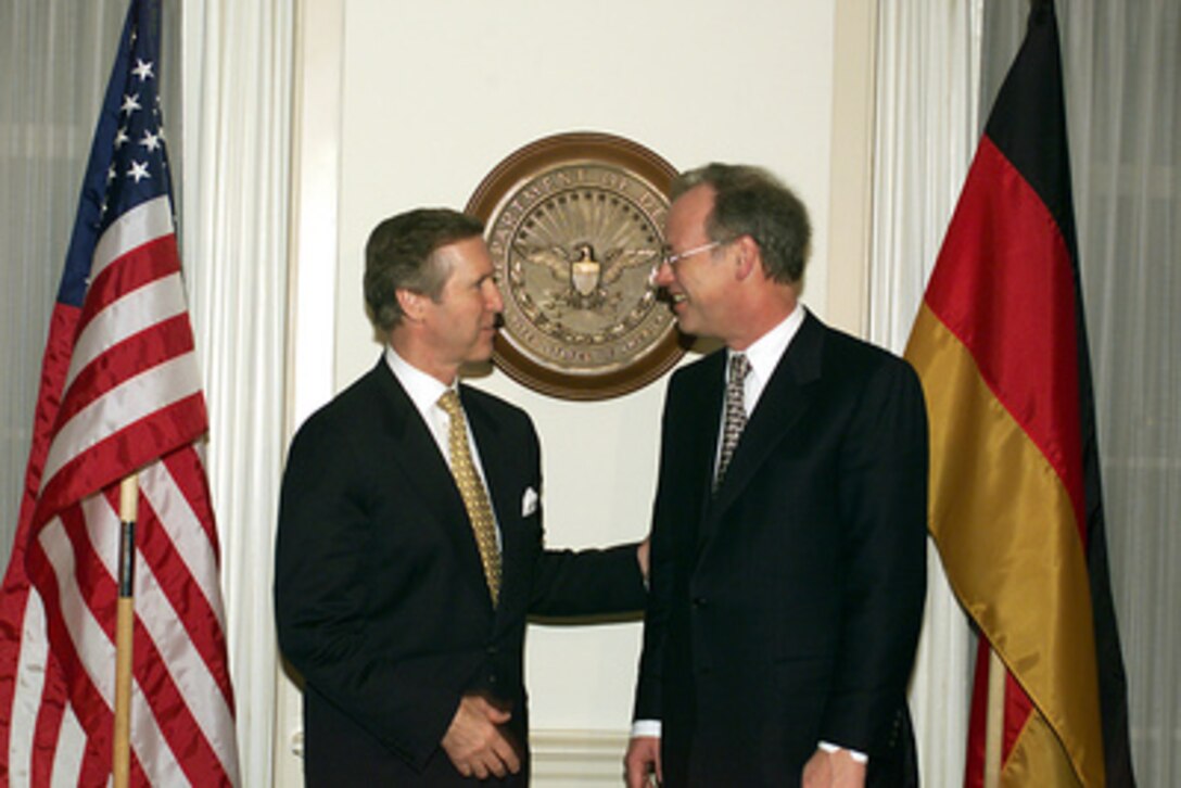 Secretary of Defense William S. Cohen (left) welcomes German Minister of Defense Rudolf Scharping (right) to the Pentagon, on March 1, 2000. Cohen and Scharping are having a working dinner to discuss Scharping's recent visit with Russia defense leaders as well as the normal range of European security issues. 