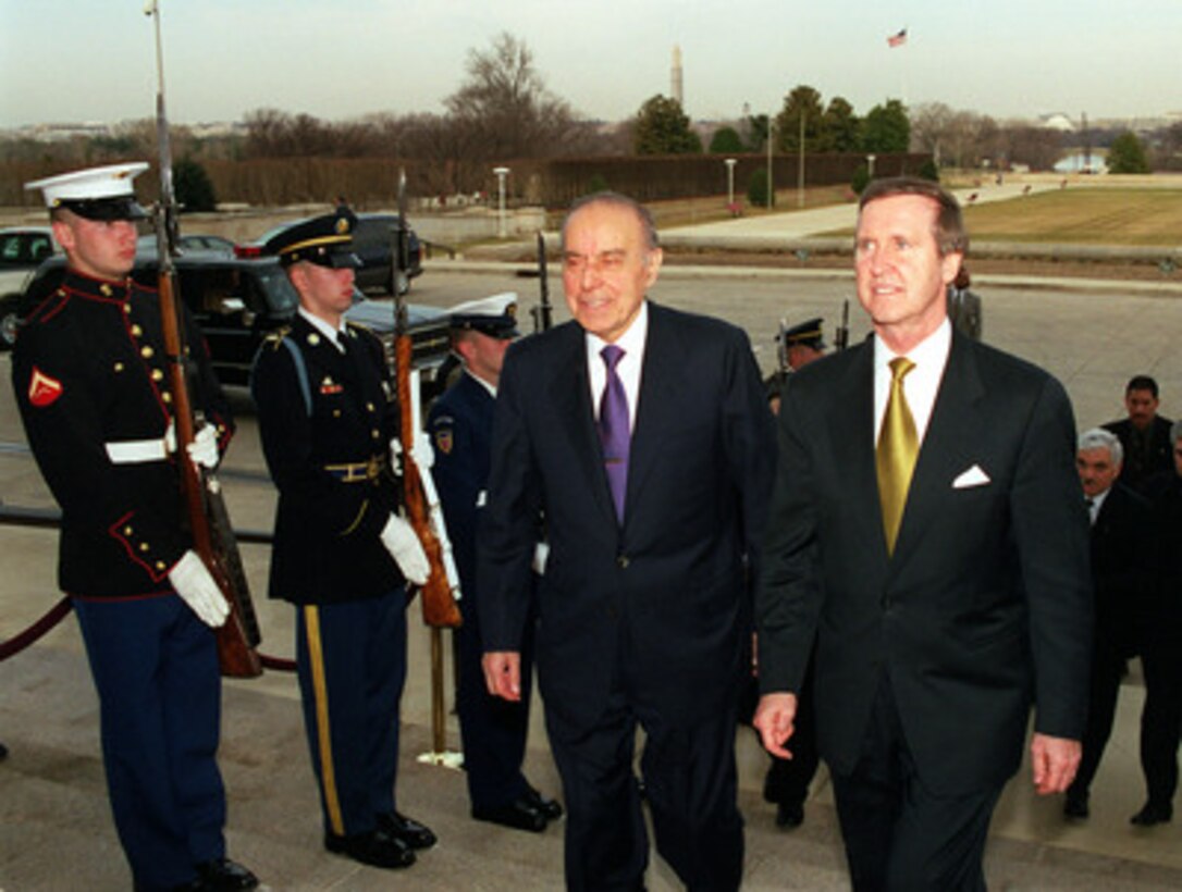 Secretary of Defense William S. Cohen (right) escorts President Heydar Aliyev (left), of the Azerbaijani Republic, through an honor cordon and into the Pentagon on Feb. 24, 2000. The two men and their senior advisors will meet to discuss a range of regional security issues of interest to both nations. 