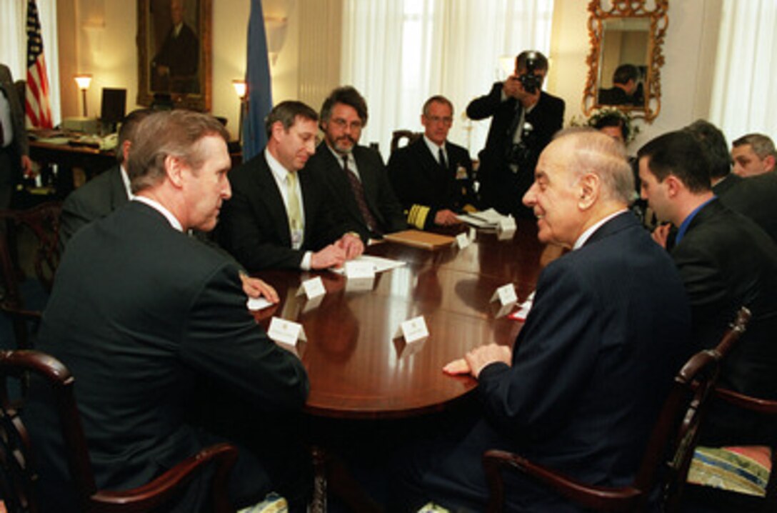 Secretary of Defense William S. Cohen (left) meets with President Heydar Aliyev (right foreground), of the Azerbaijani Republic, in Cohen's Pentagon office on Feb. 24, 2000. The two men and their senior advisors are meeting to discuss a range of regional security issues of interest to both nations. 