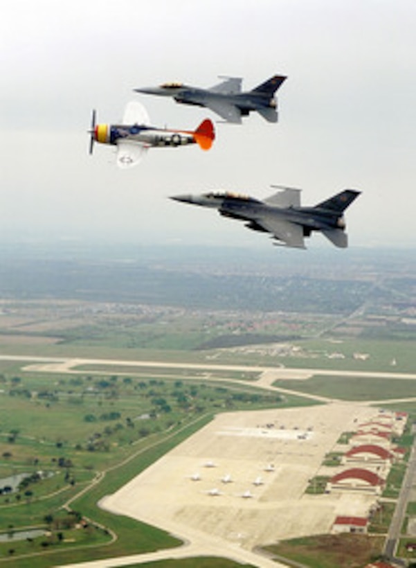 The P-47 Thunderbolt Tarheel Hal is followed by two demonstration team F-16 Fighting Falcons as they fly over Randolph Air Force Base, Texas, on March 5, 2000, during the Air Combat Command Heritage Flight Conference. The conference gives the demonstration team pilots an opportunity to discuss operations and conduct flight training with the vintage aircraft pilots who will fly with them as a team during the upcoming air show season. The upper Fighting Falcon is from the 20th Fighter Wing, Shaw Air Force Base, S.C. The lower F-16 is from the 388th Fighter Wing, Hill Air Force Base, Utah. 