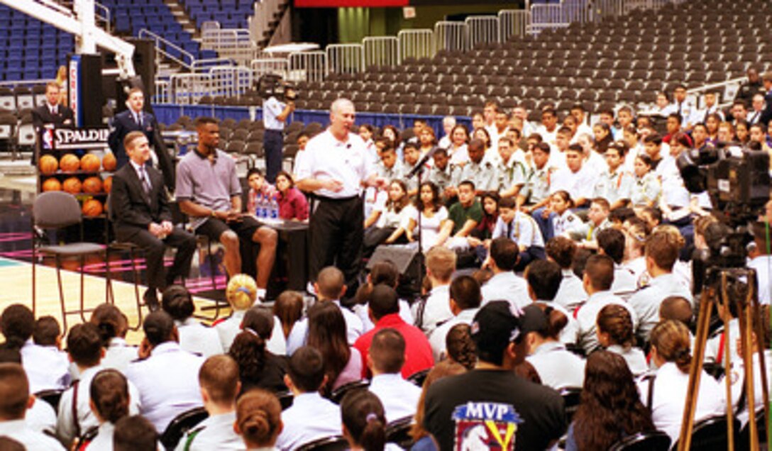 San Antonio Spurs' Head Coach Gregg Popovich (center) is joined by Secretary of Defense William S. Cohen (seated left) and Spurs' player David Robinson (seated right) as he talks with about 300 Junior ROTC cadets from local high schools at the Alamo Dome, in San Antonio, Texas, on March 3, 2000. Popovich, a graduate of the U.S. Air Force Academy and Robinson, a graduate of the U.S. Naval Academy, were able to provide many personal insights on how their experiences in the military had helped them develop the attitudes and personality traits that lead them to success in other aspects of their lives. 