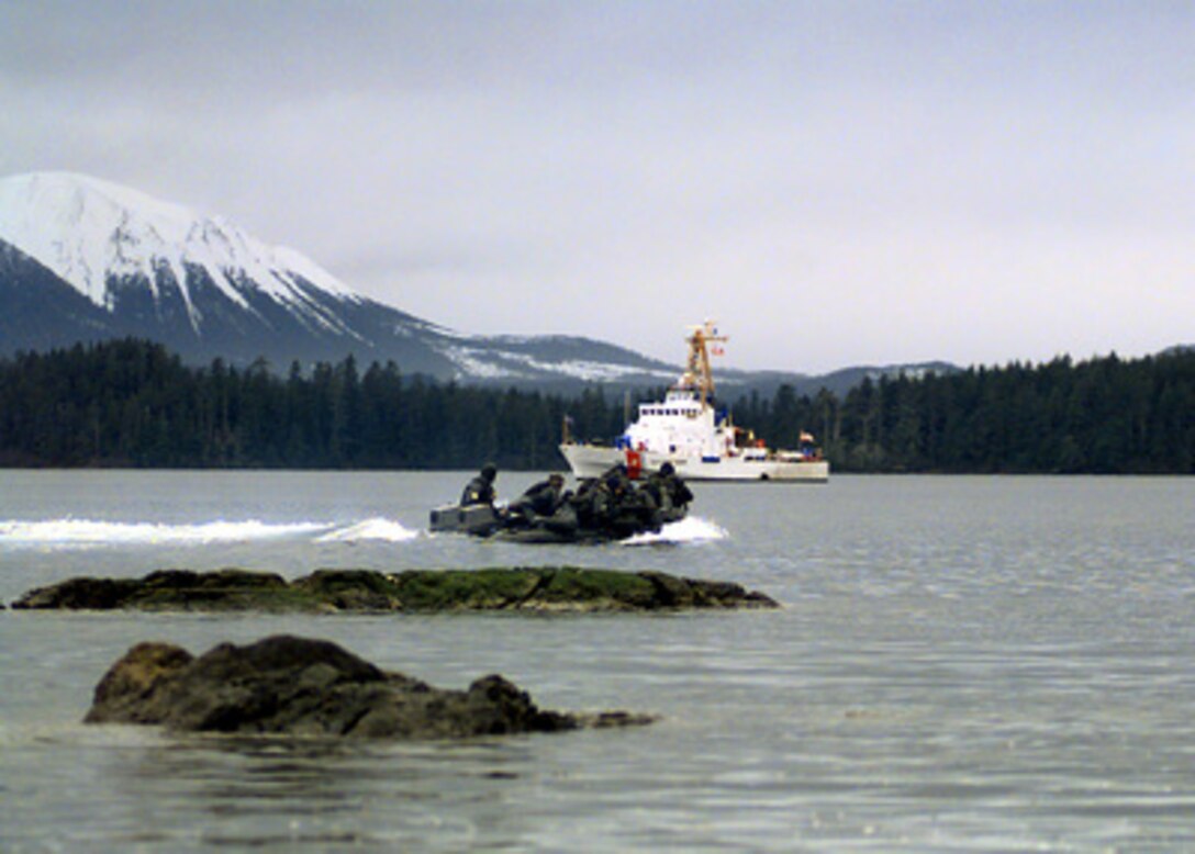 U.S. Marines from Echo Company, 4th Marine Reconnaissance Battalion use a combat rubber raiding craft to return to the Coast Guard cutter Anacapa in Sitka Bay, Alaska, on March 2, 2000, during Exercise Northern Edge 2000. Northern Edge 2000 is Alaska's largest joint military training exercise involving over 10,000 men and women from all five services. The 110-foot Anacapa is based in Petersburg, Alaska. 