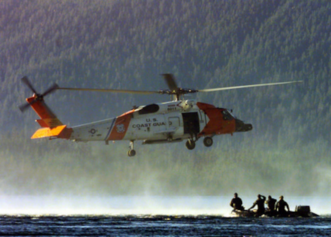 U.S. Marines from Echo Company, 4th Marine Reconnaissance Battalion wait in a combat rubber raiding craft for other members of their team to jump from a U.S. Coast Guard HH-60J Jayhawk helicopter into Starrigavan near Sitka, Alaska, during Exercise Northern Edge 2000 on March 5, 2000. Northern Edge 2000 is Alaska's largest joint military training exercise involving over 10,000 men and women from all five services. 