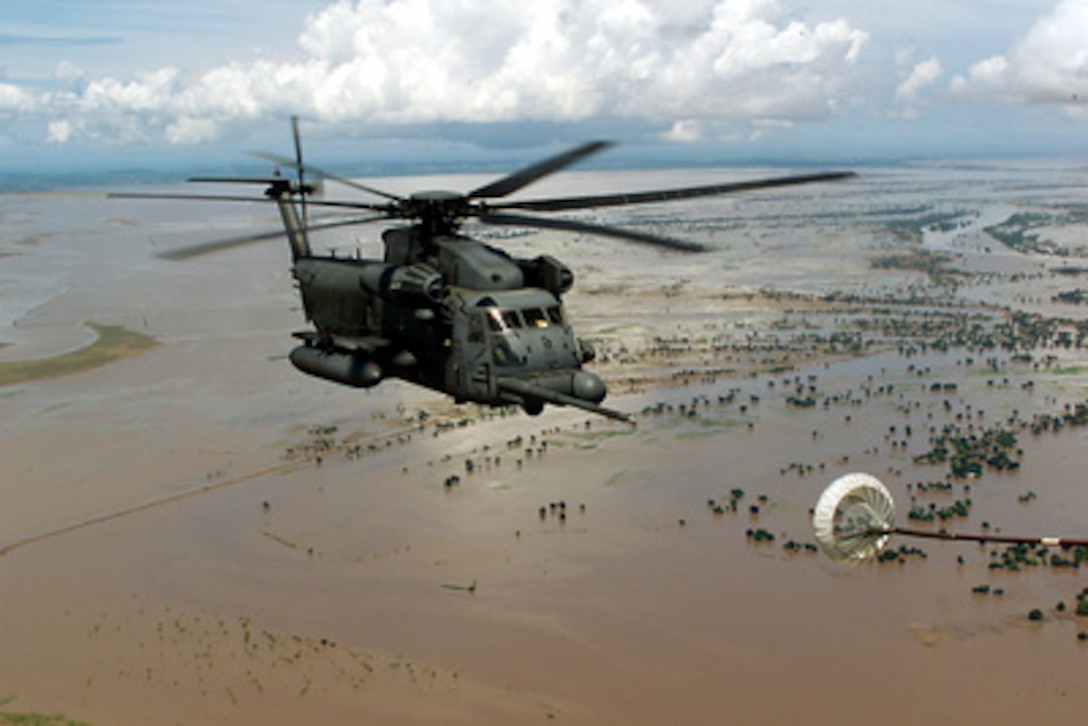 An MH-53M Pave Low IV helicopter approaches the refueling basket of an MC-130P Combat Shadow for in-flight refueling as the aircraft fly over flooded Central Mozambique on March 20, 2000, during Operation Atlas Response. Operation Atlas Response is the U.S. military's contribution to relief efforts following torrential rains and flooding in southern Mozambique and South Africa. The Pave Low helicopter is deployed for the operation from the 21st Special Operations Squadron and the Combat Shadow is deployed from the 67th Special Operations Squadron, both of RAF Mildenhall, England. 