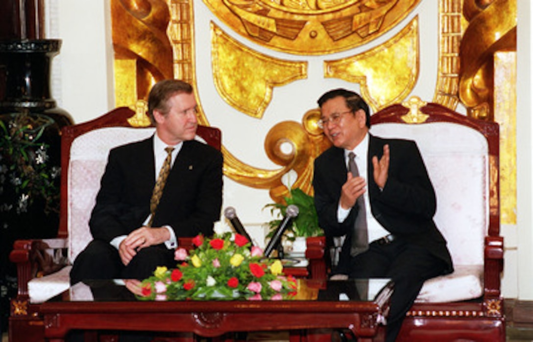 Vietnamese Minister of Foreign Affairs Nguyen Duy Nien (right) meets in his Hanoi office with Secretary of Defense William S. Cohen (left) on March 14, 2000. Cohen is the first U.S. defense secretary to visit Vietnam since the end of the Vietnam War in 1975. 