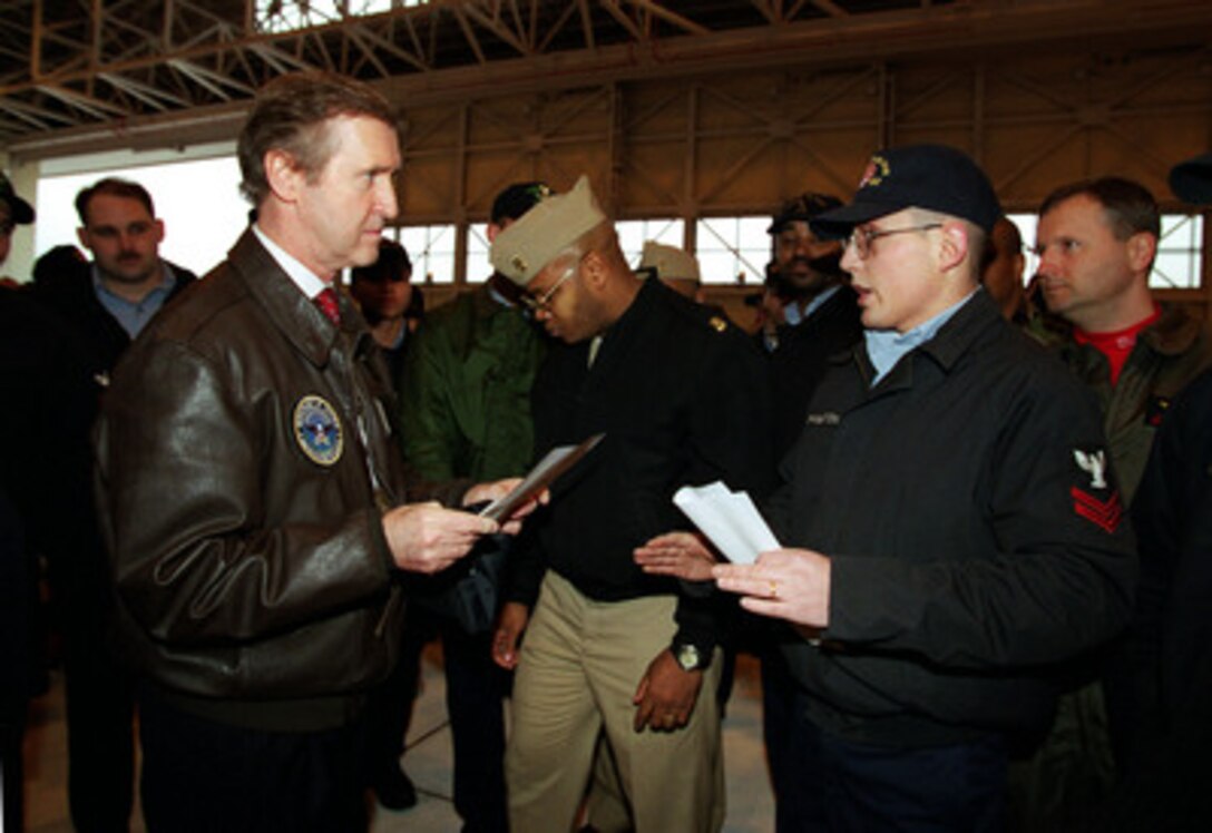 Secretary of Defense William S. Cohen (left) listens to the concerns of a sailor stationed at Naval Air Station Atsugi, Japan, on Mar. 16, 2000. Cohen is in Japan to meet with U.S. troops stationed there and Japanese defense leaders. 