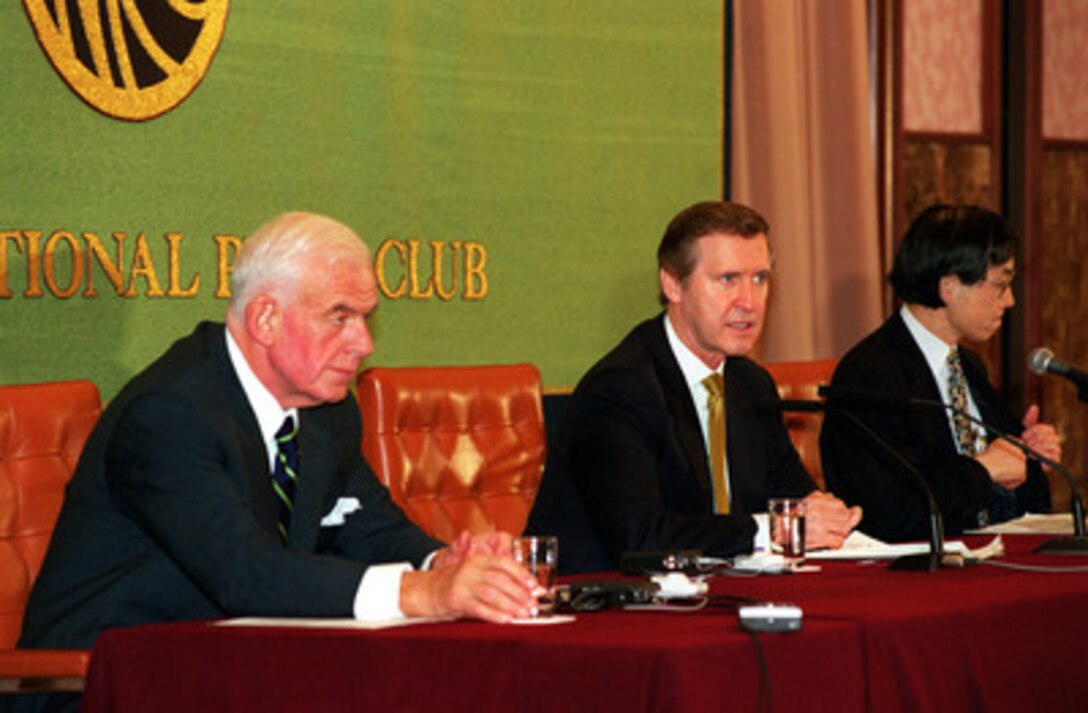 U.S. Ambassador to Japan Thomas Foley (left) accompanies Secretary of Defense William S. Cohen (center) during a press briefing at the Japan Press Club in Tokyo, Japan, on Mar. 16, 2000. Cohen urged the Japanese people to continue providing host nation support for U.S. forces forward deployed in Japan. 