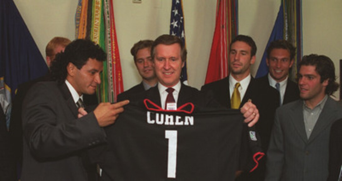 Marco Etcheverry, D.C. United's star player from Bolivia, presents an official team jersey to Secretary of Defense William Cohen in his Pentagon office, May 4, 2000. The D.C. United are Major League Soccer's 1999 Eastern Division Champions. 