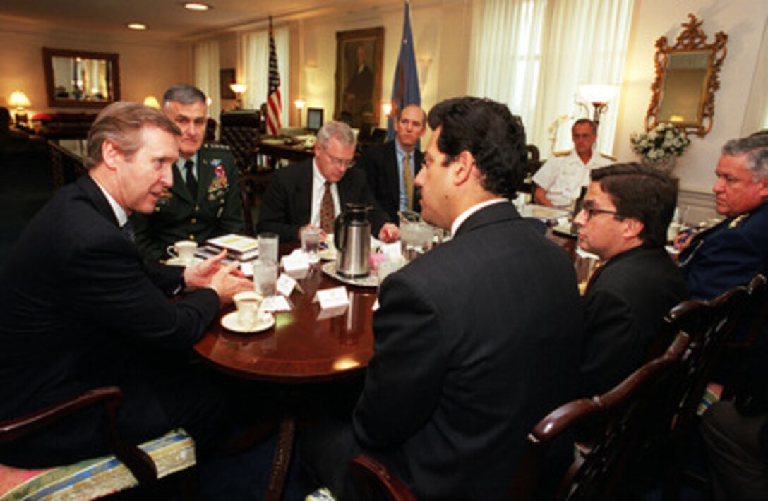 Secretary of Defense William S. Cohen (left), and Chairman of the Joint Chiefs of Staff Gen. Henry H. Shelton (2nd from left), U.S. Army, meet with Colombian Minister of National Defense Luis Fernando Ramirez (left, foreground) in Cohen's Pentagon office on April 27, 2000. The defense leaders and their senior policy advisors are meeting to discuss a broad range of security issues of interest to both nations. Cohen and Shelton are joined by Under Secretary of Defense (Policy) Walter B. Slocombe (3rd from left) and Principal Deputy Under Secretary of Defense (Policy) James Bodner. Ramirez is joined by the Colombian Ambassador Luiz Alberto Moreno (2nd from right) and Lt. Gen. Alfonso Ordonez, chief of the Colombian Joint Staff. 