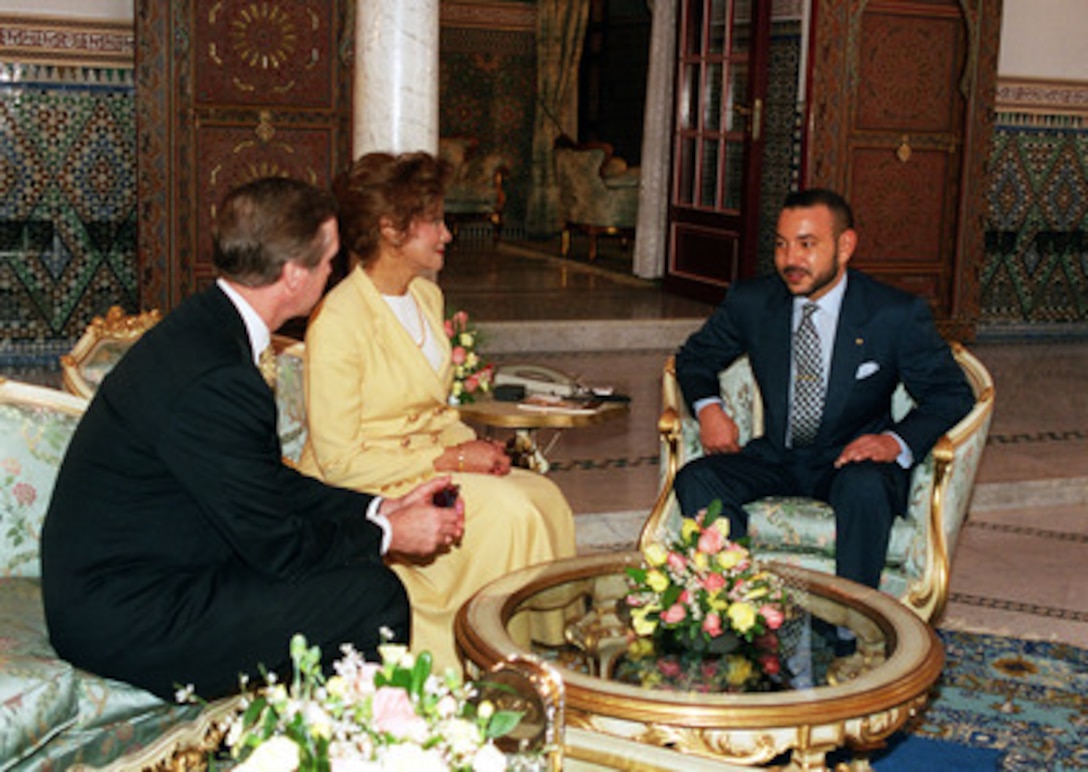 Secretary of Defense William S. Cohen (left) and his wife Janet Langhart Cohen (center) meet with King Mohammed VI, of Morocco, at his palace in Marrakech, on Feb. 11, 2000. Cohen and the King agreed to open an expanded security and defense dialogue, and discussed ways that Morocco could expand its leadership role in promoting regional stability in the Mediterranean and on the African continent. 