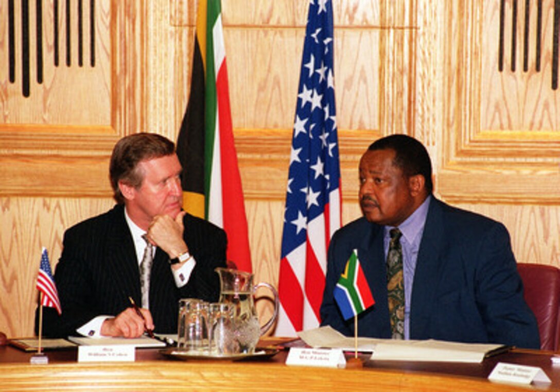 Secretary of Defense William S. Cohen (left) meets with South African Minister of Defense Patrick Lekota (right) at the South African Ministry of Defense Building, Pretoria, South Africa, on Feb. 15, 2000. The two men are meeting to discuss a range of security issues of interest to both nations. 