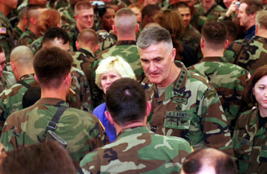 Chairman of the Joint Chiefs of Staff Gen. Henry H. Shelton, U.S. Army, and his wife Carolyn, mingle with the troops of Task Force Falcon during a troop visit to Camp Bondsteel, Kosovo, on May 1, 2000. 