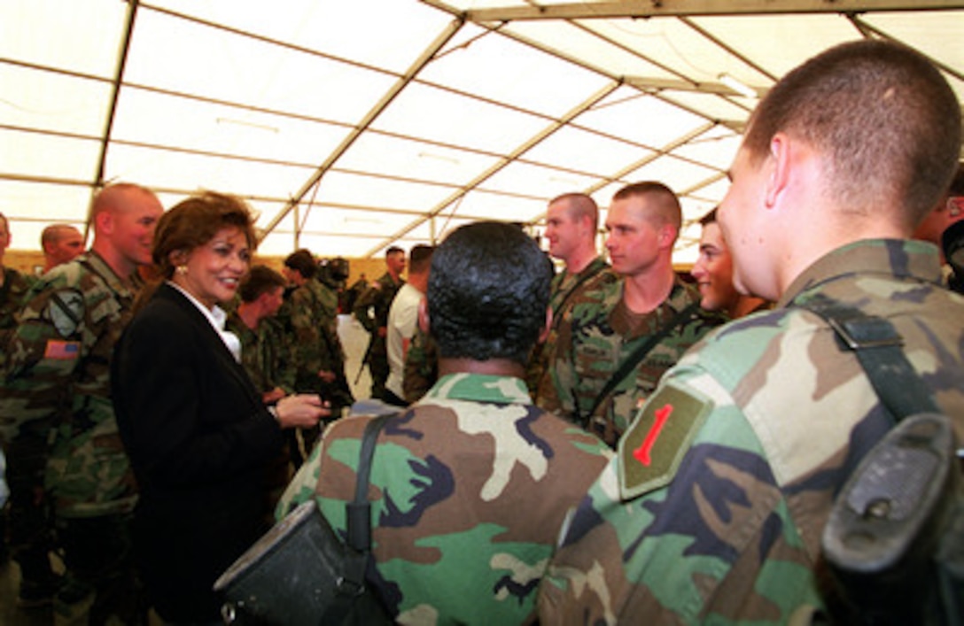 Janet Langhart Cohen, wife of Secretary of Defense William S. Cohen, talks to soldiers about their quality of life during a troop visit to Camp Bondsteel, Kosovo, on May 1, 2000. Mrs. Cohen accompanied her husband during his trip to Kosovo, Germany, and Belgium. 