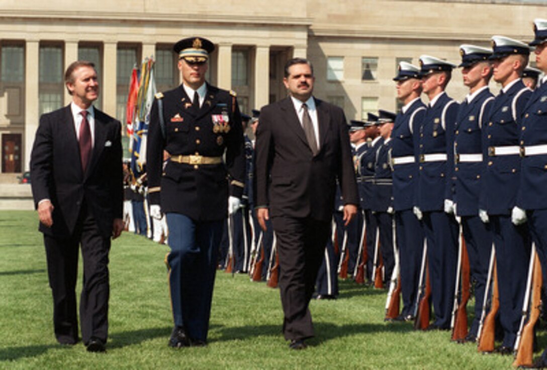 Minister of Defense Ricardo Lopez Murphy (right), of Argentina, is escorted by Commander of Troops Col. Thomas M. Jordan (center), U.S. Army, and Secretary of Defense William S. Cohen (left), as he inspects the troops during an armed forces full honor arrival ceremony in his honor at the Pentagon on May 17, 2000. Lopez Murphy and Cohen will meet to discuss a range of security issues of interest to both nations. 