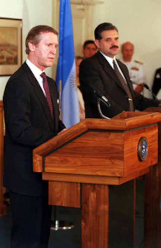 Secretary of Defense William S. Cohen (left) and Minister of Defense Ricardo Lopez Murphy (right) of Argentina, take questions from reporters in the Pentagon, on May 17, 2000. Cohen and Lopez Murphy met beforehand in private and in concert with their senior advisors to discuss a broad range of security issues of interest to both nations. 