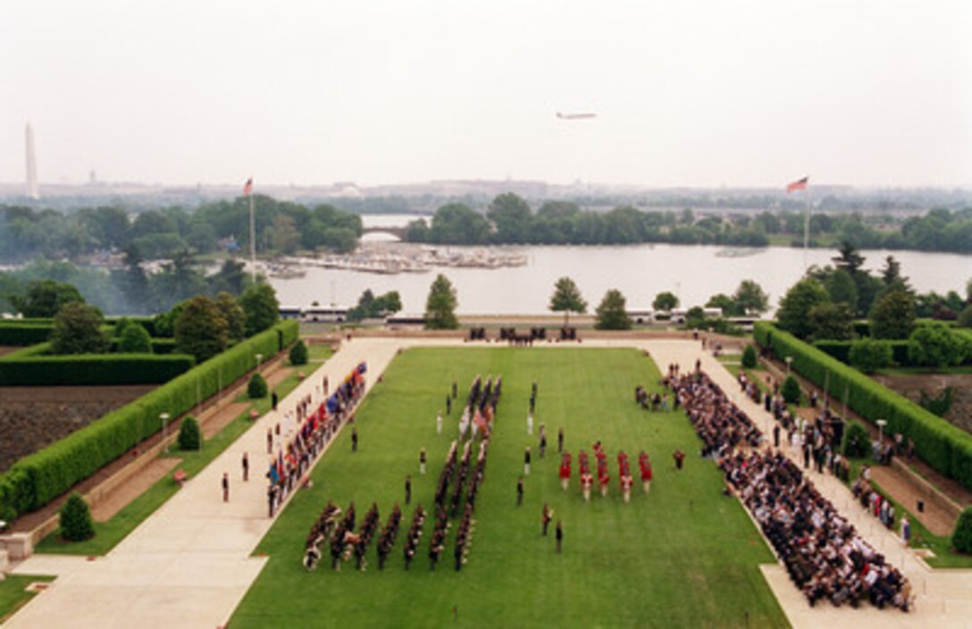 The Colonial Fife and Drum Corps sounds off as they march on the Pentagon Parade Field before a large audience of Department of Defense officials and guests during the 50th Anniversary of Armed Forces Day ceremony at the Pentagon on May 18, 2000. Secretary of Defense William S. Cohen and Chairman of the Joint Chiefs of Staff Gen. Henry H. Shelton, U.S. Army, co-hosted the event which honored approximately 300 "unsung heroes" who are military and civilian employees of the Department of Defense in the National Capital region. 