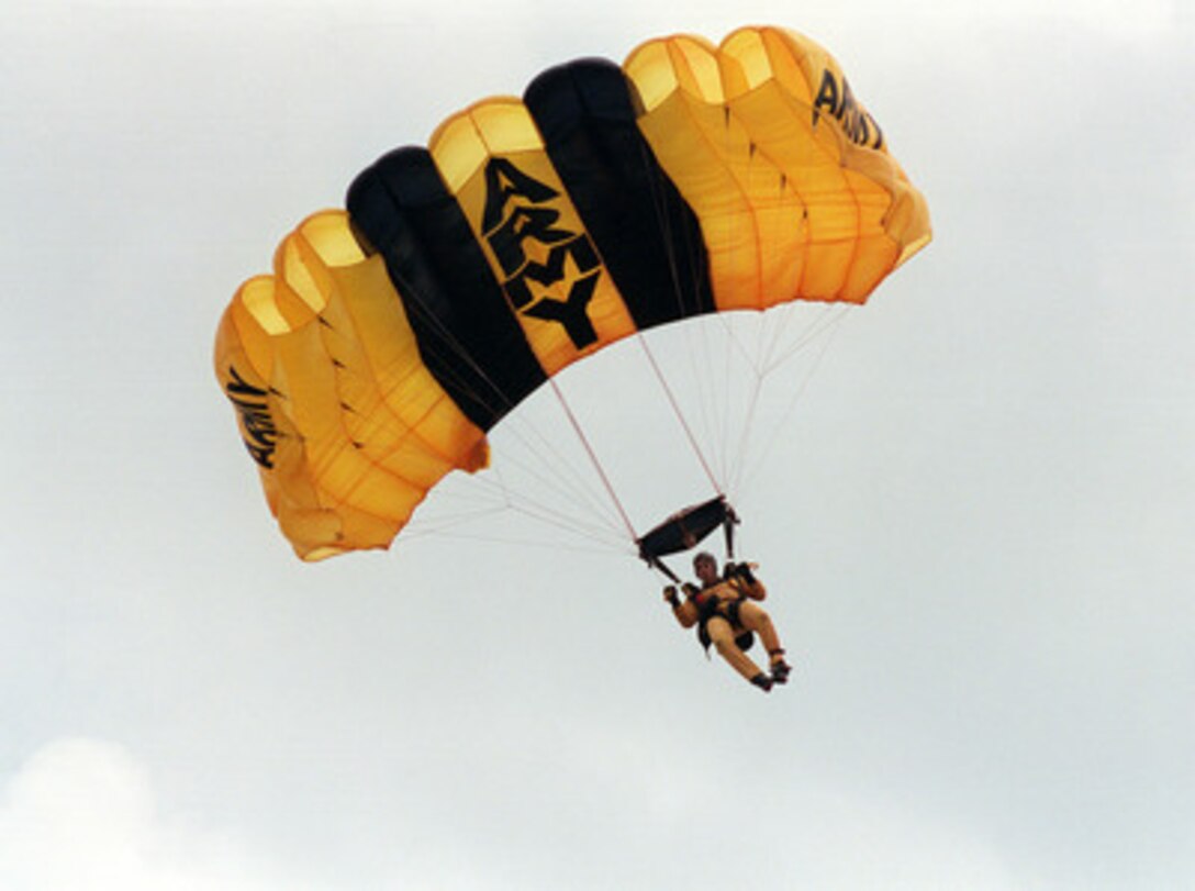 A member of the U.S. Army's Golden Knights Parachute Team comes in for a landing in the center of the Pentagon Parade Field at the conclusion of the 50th Anniversary of Armed Forces Day ceremony at the Pentagon on May 18, 2000. Secretary of Defense William S. Cohen and Chairman of the Joint Chiefs of Staff Gen. Henry H. Shelton, U.S. Army, co-hosted the event which honored approximately 300 "unsung heroes" who are military and civilian employees of the Department of Defense in the National Capital region. 
