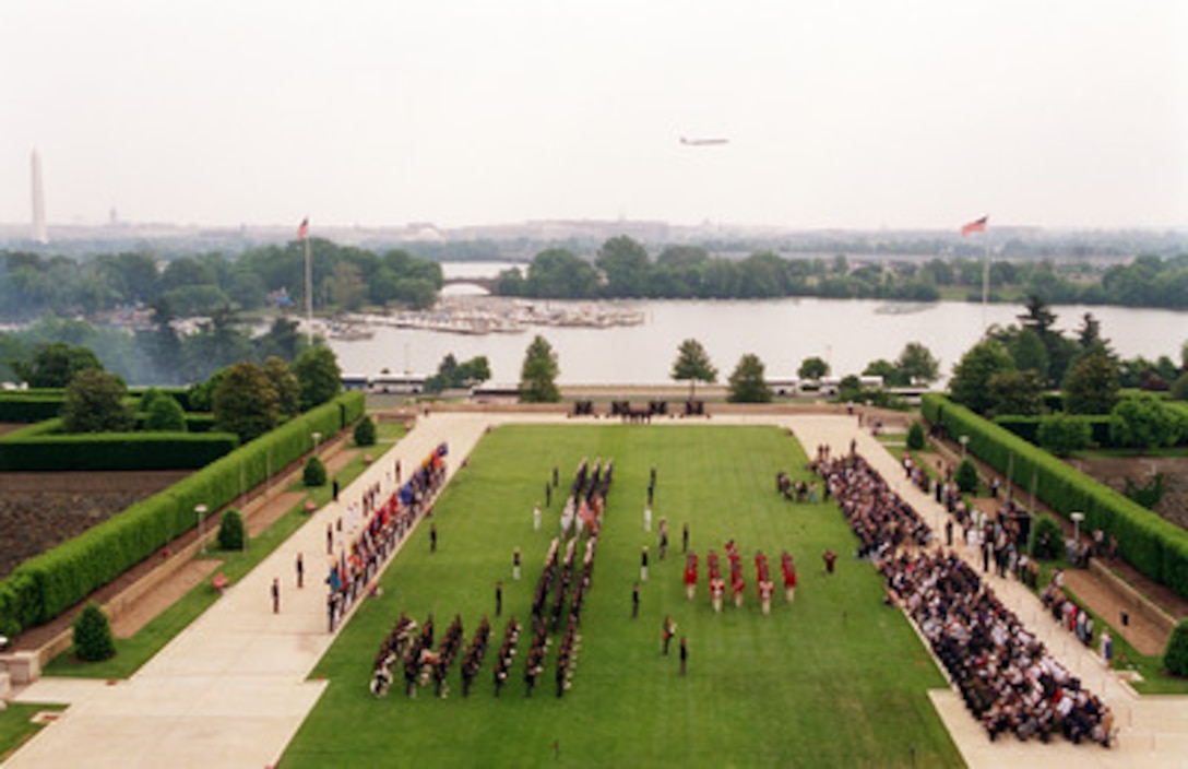 The Colonial Fife and Drum Corps sounds off as they march on the Pentagon Parade Field before a large audience of Department of Defense officials and guests during the 50th Anniversary of Armed Forces Day ceremony at the Pentagon on May 18, 2000. Secretary of Defense William S. Cohen and Chairman of the Joint Chiefs of Staff Gen. Henry H. Shelton, U.S. Army, co-hosted the event which honored approximately 300 "unsung heroes" who are military and civilian employees of the Department of Defense in the National Capital region. 