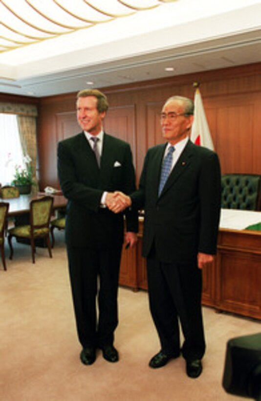 Secretary of Defense William S. Cohen (left) and Minister of State for Defense Kazuo Torashima (right) pose for photographers prior to their meeting at the Japan Defense Agency Headquarters in Tokyo, Japan, on Sept. 22, 2000. Cohen is in Japan to meet with government officials and defense leaders. 