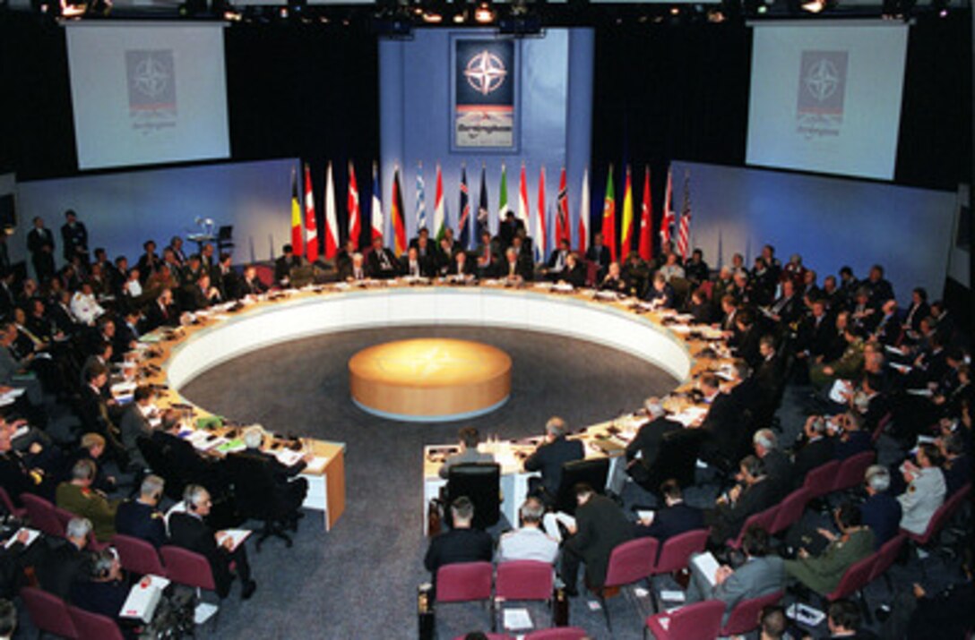 The annual Informal Meeting of NATO Defense Ministers comes to order at the International Conference Center in Birmingham, England, on Oct. 10, 2000. Each Autumn a different member of the 19-nation security alliance hosts the informal meeting in which a range of security issues are freely discussed, but no binding decisions are made. All binding agreements are left to the biannual defense ministerial held at NATO Headquarters in Brussels, Belgium. 