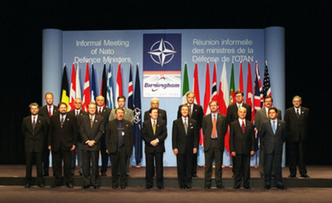 Defense ministers of NATO nations pose as a group for photographers atthe annual Informal Meeting of NATO Defense Ministers in Birmingham, England, on Oct. 10, 2000. Each Autumn a different member of the 19-nation security alliance hosts the informal meeting in which a range of security issues are freely discussed, but no binding decisions are made. All binding agreements are left to the biannual defense ministerial held at NATO Headquarters in Brussels, Belgium. 1st Row, left to right: Hans Haekkerup, minister of defense, Denmark; Vladimir Vetchy, minister of defense, the Czech Republic; Arthur Eggleton, minister of defense, Canada; Andre Flahaut, minister of defense, Belgium; Lord George Robertson, NATO Secretary General; William S. Cohen, secretary of defense, USA; Geoffrey Hoon, secretary of state for defense, the United Kingdom; Sabahattin Cakmakoglu, minister of defense, Turkey; Federico Trillo, minister of defense, Spain. Back Row, left to right: Rudolf Scharping, minister of defense, Germany; Apostolos-Athanasios Tsohatzopoulos, minister of defense, Greece; Janos Szabo, minister of defense, Hungary; Gunnar Palsson, Iceland's ambassador to NATO; Sergio Mattarella, minister of defense, Italy; Charles Goerens, minister of defense, Luxembourg; Bjorn Tore Godal, minister of defense, Norway; Bronislaw Komorowski, minister of defense, Poland, and Julio Castro Caldas, minister of defense, Portugal. 
