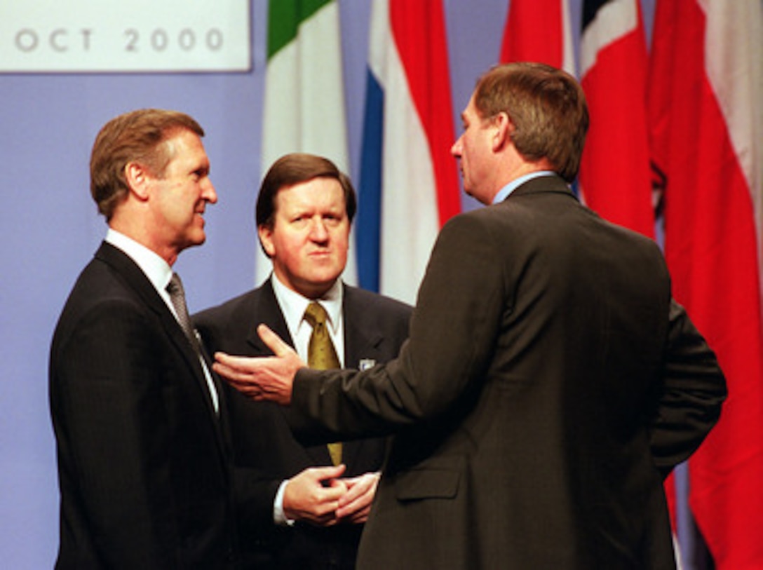 Secretary of Defense William S. Cohen (left) talks with NATO Secretary General Lord George Robertson (center) and British Secretary of State for Defense Geoffrey Hoon (right) during the annual Informal Meeting of NATO Defense Ministers at the International Conference Center in Birmingham, England, on Oct. 10, 2000. Each Autumn a different member of the 19-nation security alliance hosts the informal meeting in which a range of security issues are freely discussed, but no binding decisions are made. All binding agreements are left to the biannual defense ministerial held at NATO Headquarters in Brussels, Belgium. 