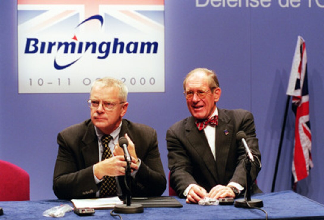 Under Secretary of Defense for Policy Walt Slocombe (left) and Assistant Secretary of Defense for Public Affairs Ken Bacon (right) hold a press conference at the annual Informal Meeting of NATO Defense Ministers at the International Conference Center in Birmingham, England, on Oct. 10, 2000. Slocombe used the forum to brief reporters in detail concerning some of the policy positions of the United States. Each Autumn a different member of the 19-nation security alliance hosts the informal meeting in which a range of security issues are freely discussed, but no binding decisions are made. All binding agreements are left to the biannual defense ministerial held at NATO Headquarters in Brussels, Belgium. 