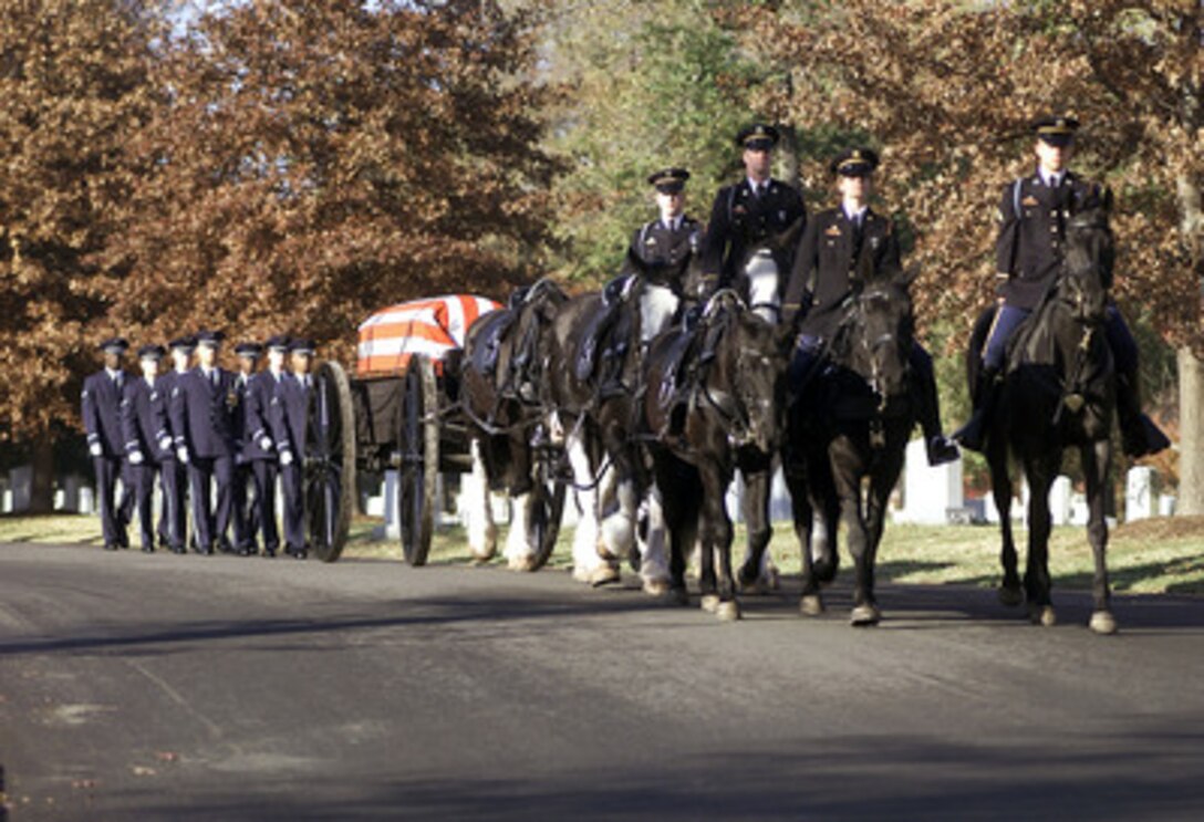 A horse-drawn caisson carries the casket of U.S. Air Force Medal of Honor recipient John L. Levitow to his grave in Arlington National Cemetery where he will be buried with full military honors on Nov. 17, 2000. Levitow earned the medal as an airman 1st class serving as loadmaster aboard a severely damaged AC-47 gunship flying a mission over Long Binh, South Vietnam, on Feb. 24, 1969. A C-17 Globemaster III was named "The Spirit of John L. Levitow," in his honor Jan. 23, 1998. Levitow died at his home in Connecticut on Nov. 8, 2000, after a lengthy battle with cancer. 
