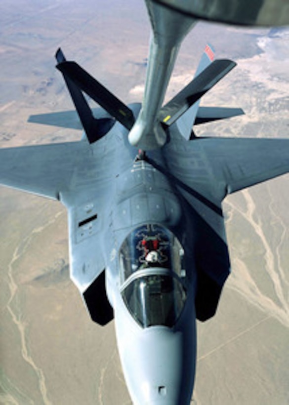 A Lockheed Martin X-35A Joint Strike Fighter concept demonstrator receives fuel from a U.S. Air Force KC-135 Stratotanker during a test mission over California's Mojave Desert on Nov. 7, 2000. The Joint Strike Fighter is the military's next generation, multi-role, strike aircraft designed to complement the Navy F/A-18 and the Air Force F-22 aircraft. Lockheed Martin and Boeing were both awarded cost-plus-fixed-fee-contracts for the Joint Strike Fighter Concept Demonstration Program. The program will feature flying aircraft demonstrators, ground and flight technology demonstrations, and continued refinement of the contractor's weapons system concept for the next generation strike fighter for the Navy, Marine Corps, Air Force, and Royal Navy. After making about 50 test flights, the X-35A and Boeing's X-32A will be tested at Naval Air Station Patuxent River, Md. Photo by Tom Reynolds, Lockheed Martin. 