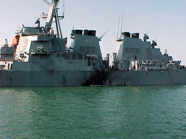 Port side view showing the damage sustained by the Arleigh Burke class guided missile destroyer USS Cole (DDG 67) on October 12, 2000, after a suspected terrorist bomb exploded during a refueling operation in the port of Aden, Yemen. USS Cole is on a regular scheduled six-month deployment.