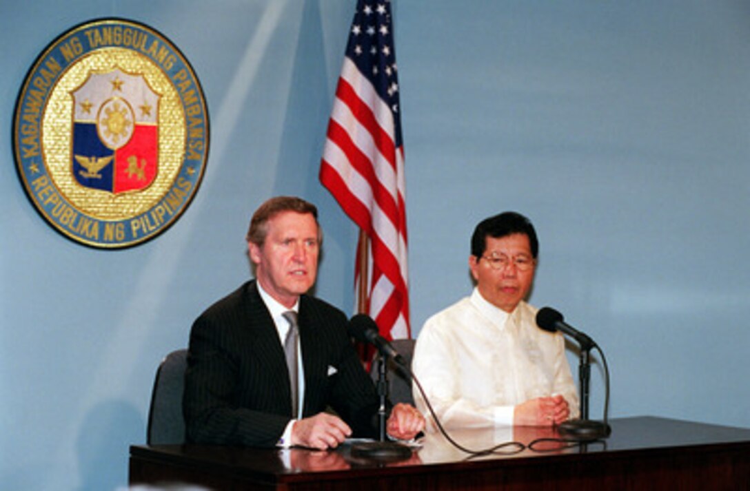 Secretary of Defense William S. Cohen (left) makes an opening statement during a joint press briefing at the Department of National Defense with his host Secretary of National Defense Orlando Mercado (right). Cohen traveled to Manila Sept. 15, 2000 to meet with Philippine officials and discuss issues of mutual interest. 